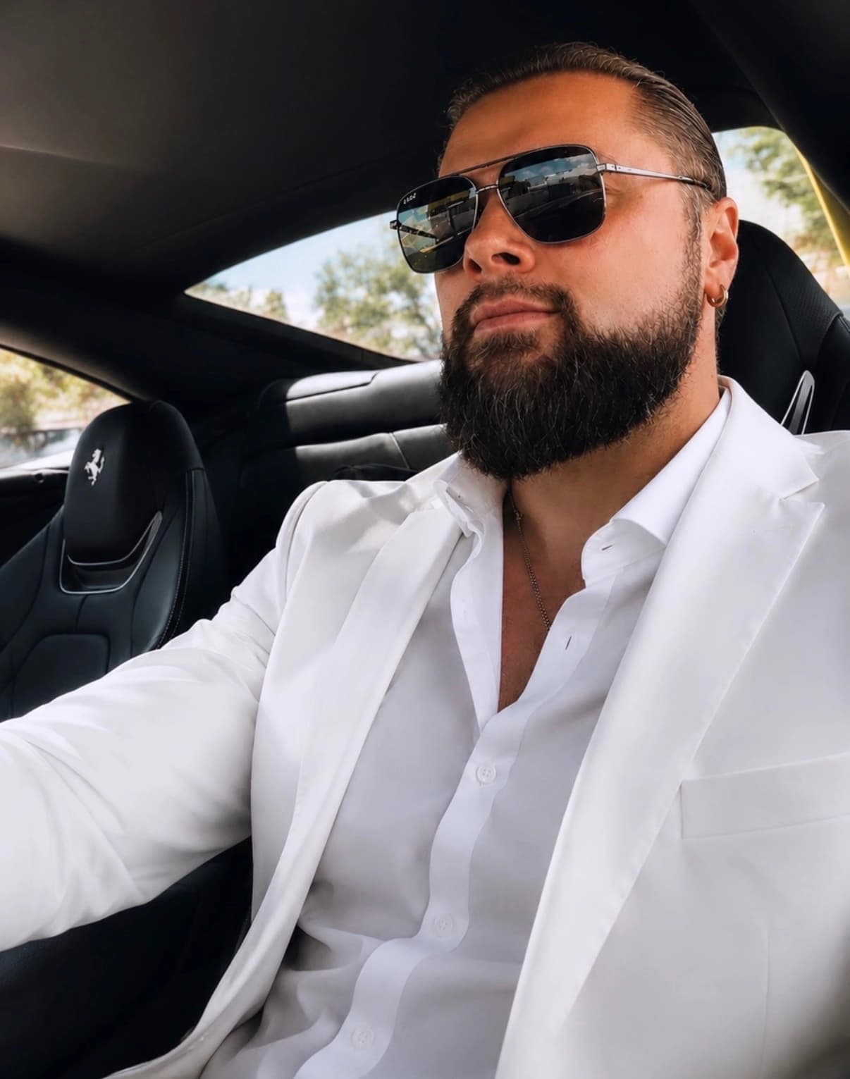 Mark Pugachev in a white suit